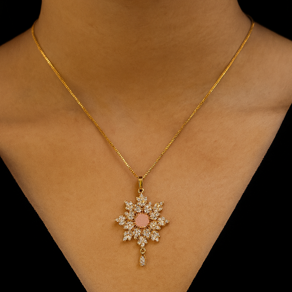 Gold necklace with a star-shaped pendant on a black background